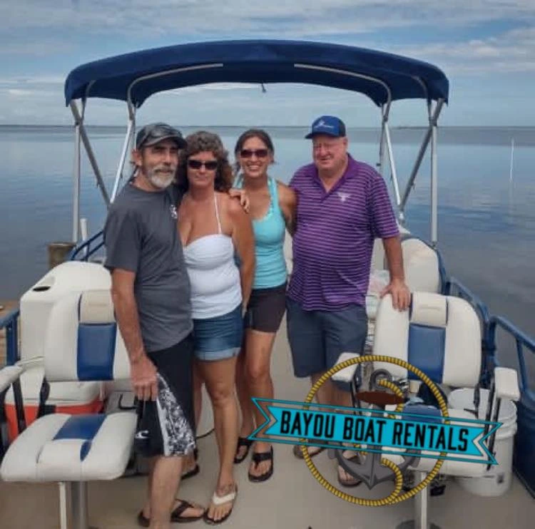 group of people standing on rental boat in port st. joe