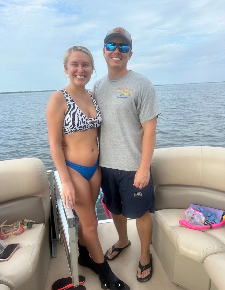 a couple on a luxury pontoon boat rental from bayou boat rentals