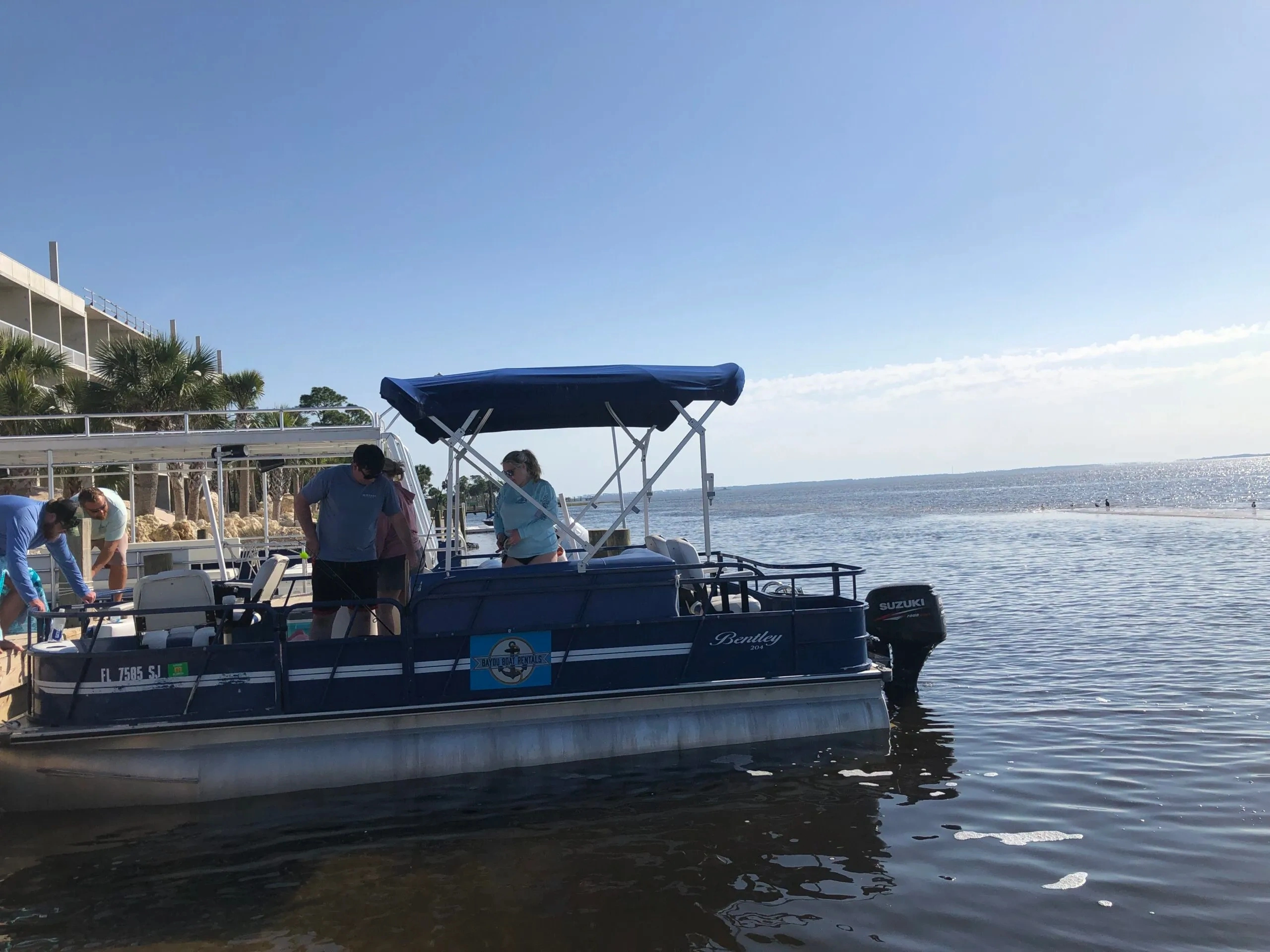 bayou boat rentals boat departing for rental trip in the bay at port st. joe